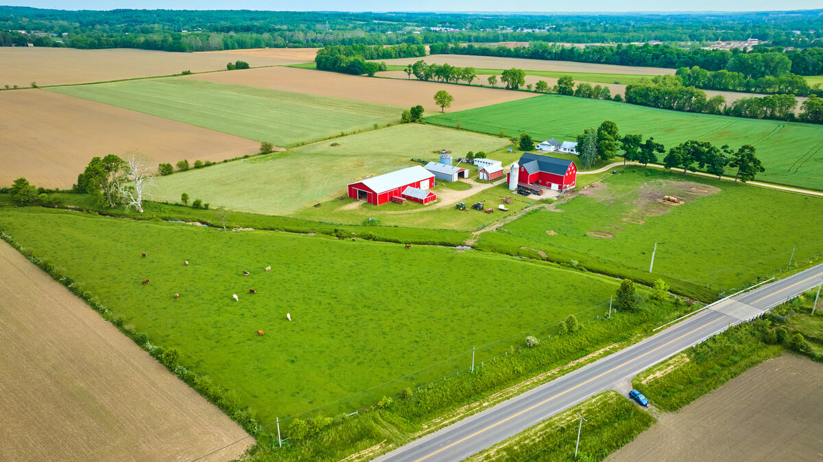 Aerial view of Arkansas farm with pasture and barn